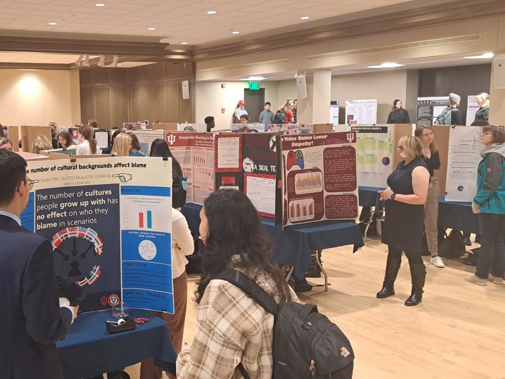 Students are seen presenting posters during the Empathy ASURE ﻿Poster Show on Dec. 6, 2022, in the Frangipani Room at the IMU. Students showcased their cumulative work from the “Literature and Science of Empathy” class offered through the ASURE program.