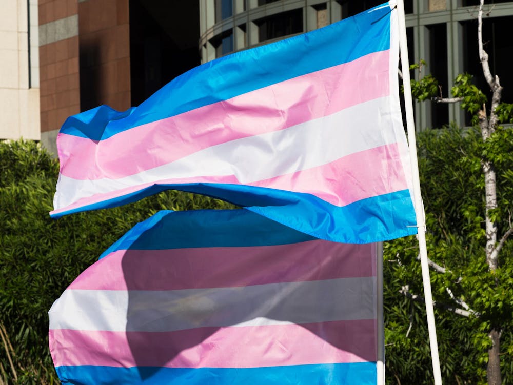 <p>Trans pride flags flutter in the wind at a gathering to celebrate International Transgender Day of Visibility, March 31, 2017, at the Edward R. Roybal Federal Building in Los Angeles. Holcomb vetoed House Bill 1041, a bill that would ban transgender girls’ participation in girls’ K-12 sports, Monday.</p>