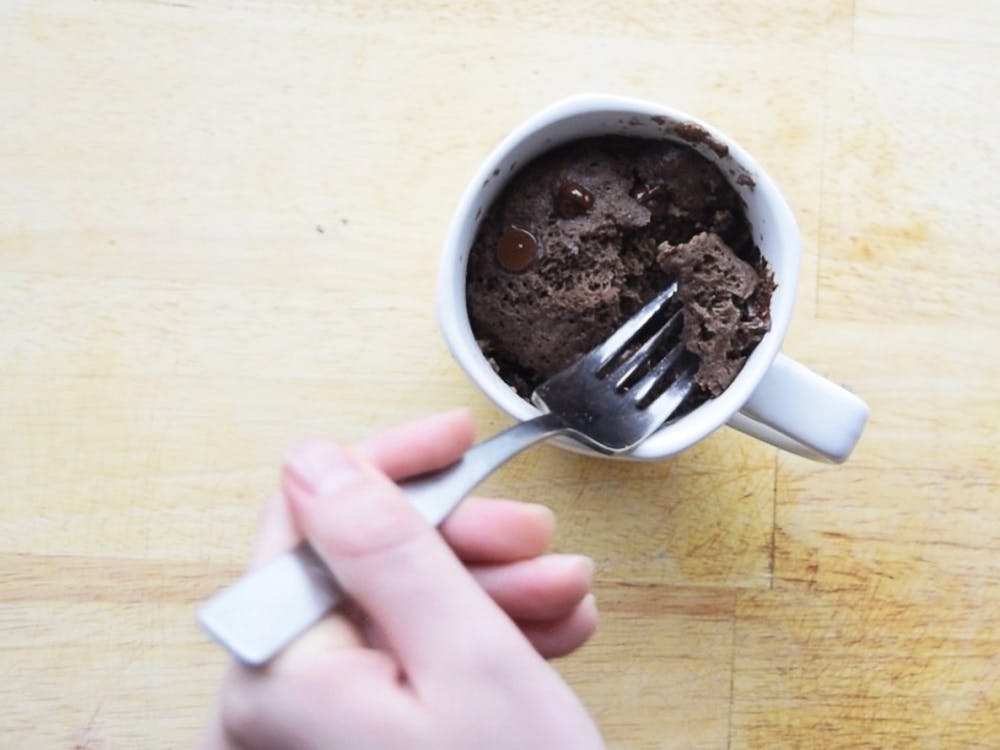 Chocolate cake in a mug is an easy way to fulfill any chocolate cravings. It only needs four ingredients and can be prepared in your residence hall.