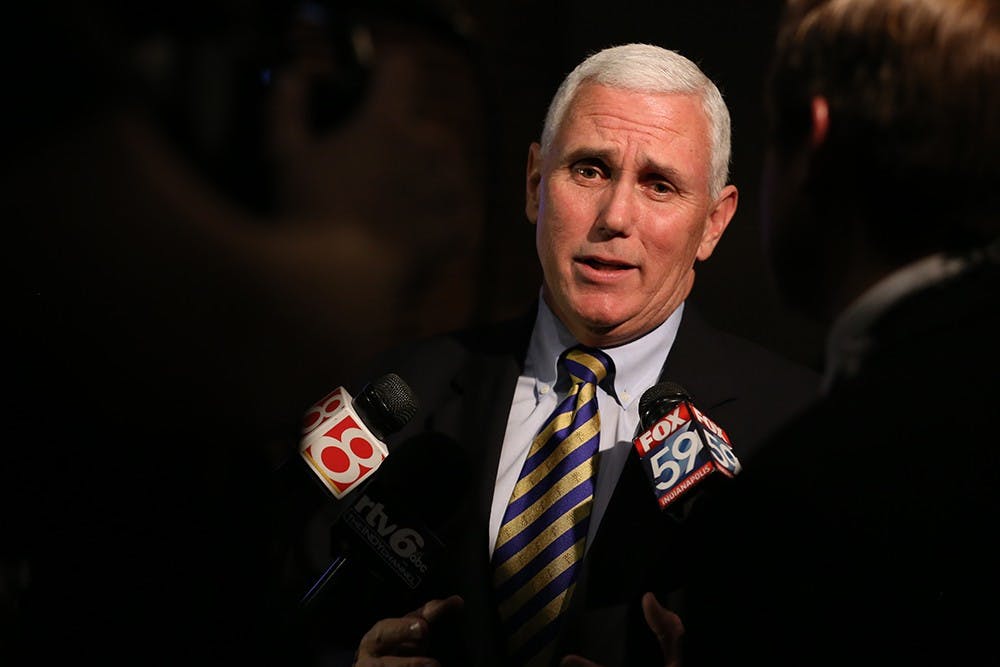 Gov. Mike Pence is interviewed by television stations at the Republican Election Night watch party in downtown Indianapolis. 

