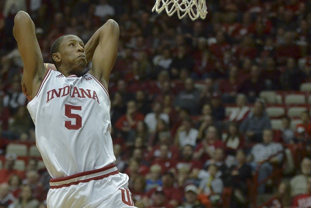 Junior forward Troy Williams jumps up for a slam dunk Monday at Assembly Hall. The Hoosiers won 112-70.
