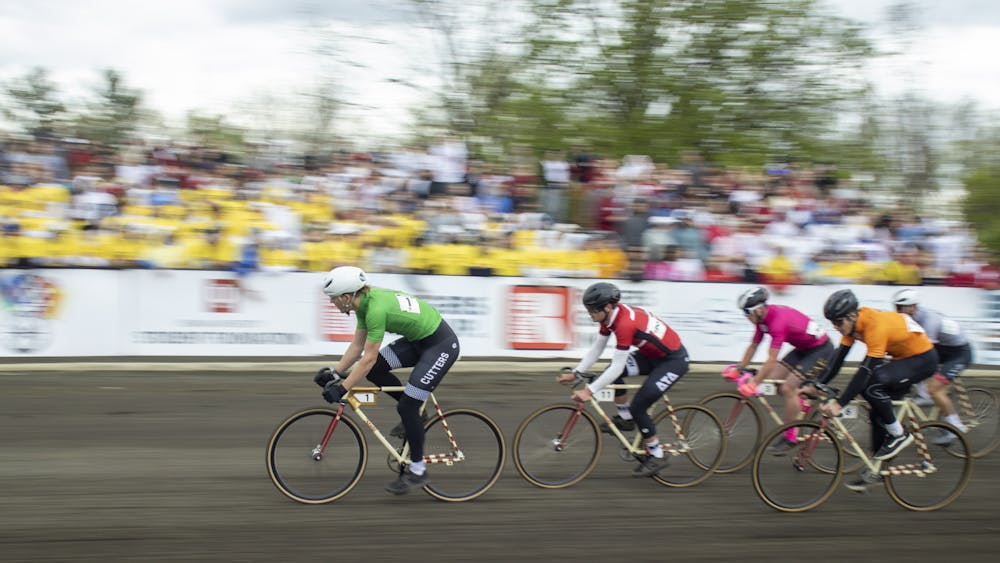 Torin Kay-Mawhorr leads a pack of riders around Turn 2 April 22, 2023, at Bill Armstrong Stadium. The Cutters won the 2023 men&#x27;s Little 500 Race.