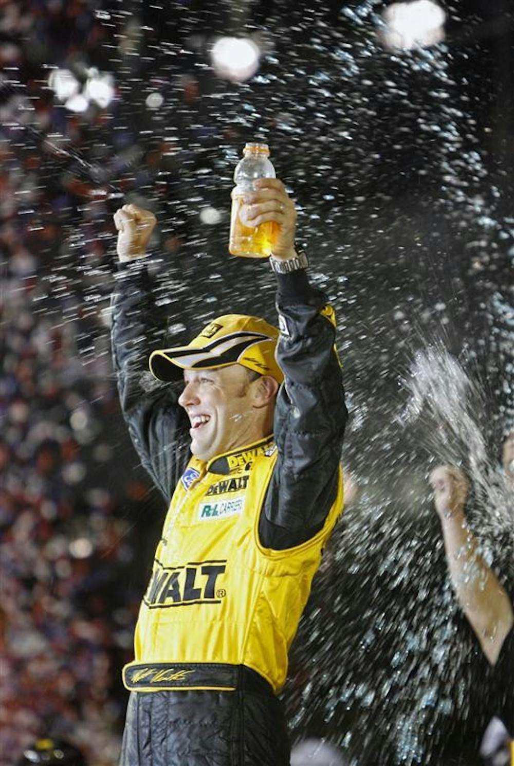 Matt Kenseth celebrates after winning the rain-shortened NASCAR Daytona 500 at Daytona International Speedway Sunday in Daytona Beach, Fla..