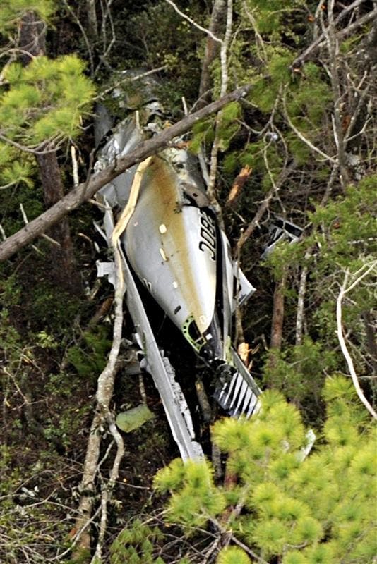 A single-engine Piper Malibu Meridian flown by Marcus Schrenker is seen after having crashed in East Milton, Fla.An Indiana businessman whose financial management companies were under investigation apparently bailed out of his small plane and let it crash in what may have been an elaborate attempt to fake his own death.