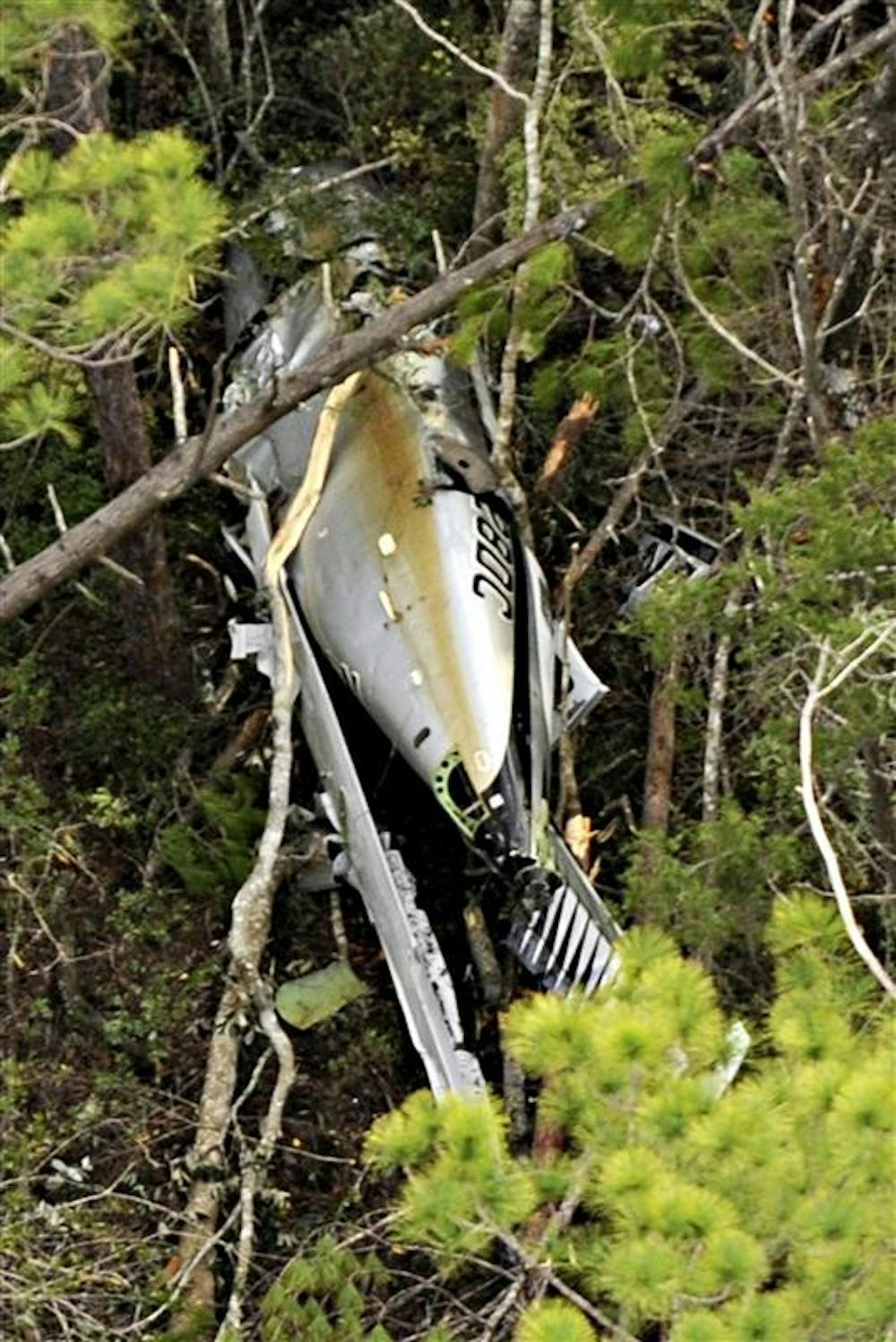 A single-engine Piper Malibu Meridian flown by Marcus Schrenker is seen after having crashed in East Milton, Fla.An Indiana businessman whose financial management companies were under investigation apparently bailed out of his small plane and let it crash in what may have been an elaborate attempt to fake his own death.