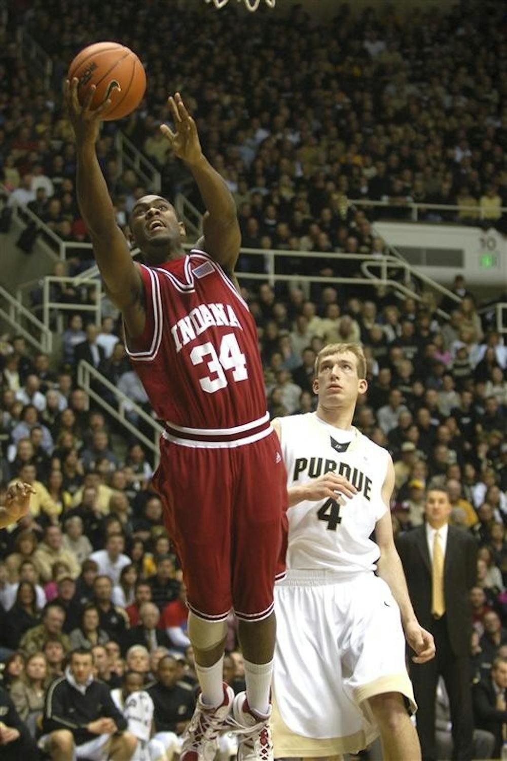 IU forward Malik Story tries to put in a layup over Purdue's Chris Kramer. Story finished the 81-67 loss on the road with 9 points and 2 rebounds.