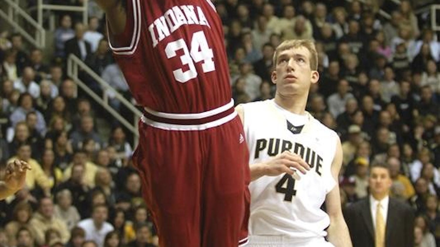 IU forward Malik Story tries to put in a layup over Purdue's Chris Kramer. Story finished the 81-67 loss on the road with 9 points and 2 rebounds.