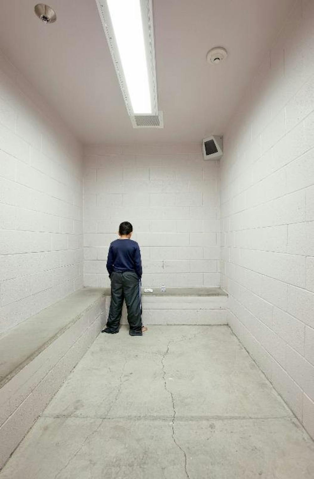 Richard Ross (American, b. 1947). "I'm waiting for my mom to come get me. Is she in there? She's at work today. I want to go home. I got in trouble at school today." -R.T., age 10. Washoe County Detention Facility, Reno, Nevada, from Juvenile in Justice, 2012.&nbsp;