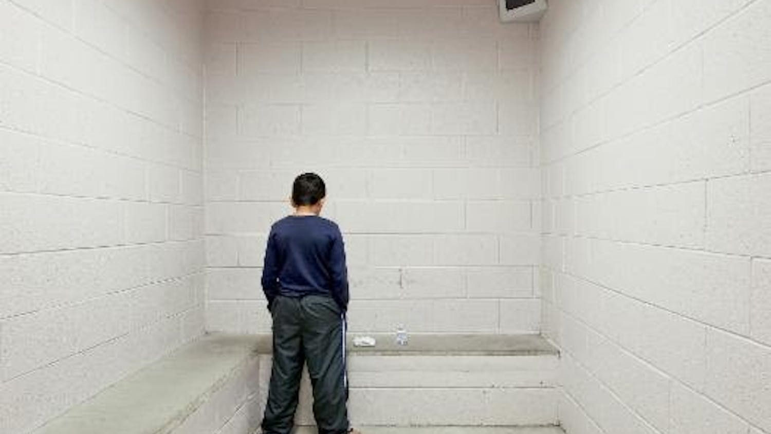 Richard Ross (American, b. 1947). "I'm waiting for my mom to come get me. Is she in there? She's at work today. I want to go home. I got in trouble at school today." -R.T., age 10. Washoe County Detention Facility, Reno, Nevada, from Juvenile in Justice, 2012.&nbsp;
