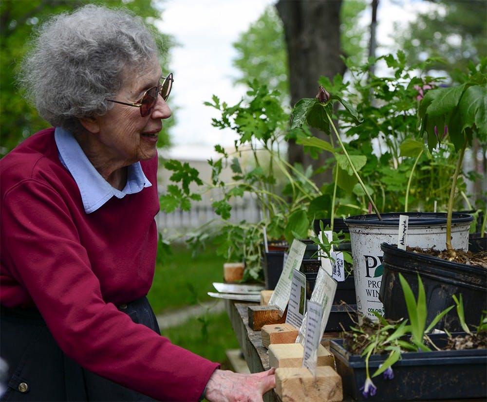 Rj Trubitt selects plants Sunday afternoon at the Hinkle-Garton Farmstead Community. These native perennials are supplied by Spence Restoration Nursery, Indiana’s premier native plant supplier, and were being sold to help build up the Hinkle-Garton Farmstead Community Historic Site. 