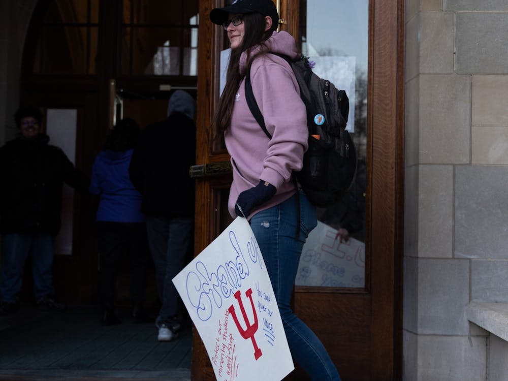 Ronnie France holds the door to the Indiana Memorial Union open for protestors Feb. 2, 2023. She spoke at the town hall about her experience as a resident assistant on campus﻿. “The residential housing community on campus has failed (Declan), and has failed so many other people like him.”