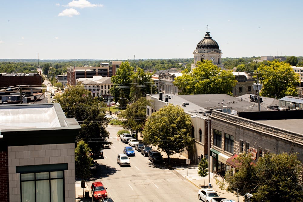 <p>A view of downtown Bloomington is seen from the Seventh and Walnut Street Parking Garage. Eleven employees for the City of Bloomington tested positive for COVID-19 in the last week, according to a city press release.</p>