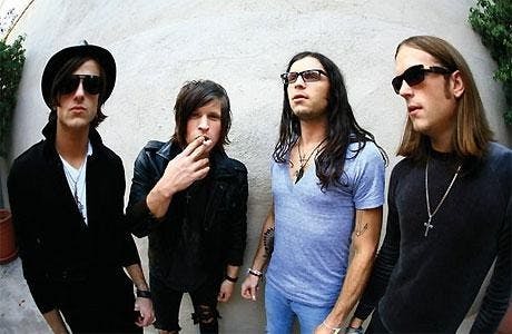 Kings Of Leon like it to keep it real With cigarettes and sunglasses.