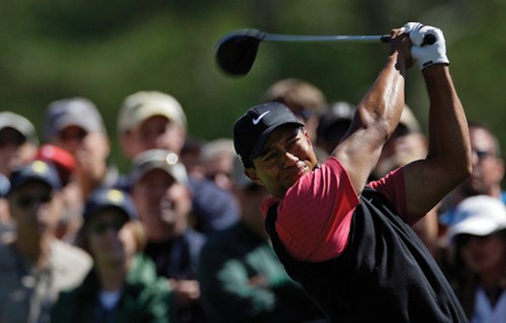 Tiger Woods tees off on the eighth hole during the final round of the 2008 Masters golf tournament at the Augusta National Golf Club in Augusta, Ga., Sunday, April 13, 2008. (AP Photo/David J. Phillip)