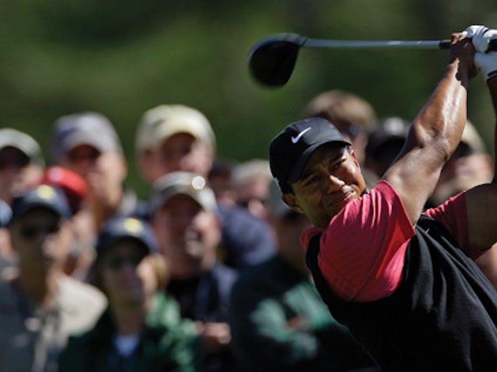 Tiger Woods tees off on the eighth hole during the final round of the 2008 Masters golf tournament at the Augusta National Golf Club in Augusta, Ga., Sunday, April 13, 2008. (AP Photo/David J. Phillip)