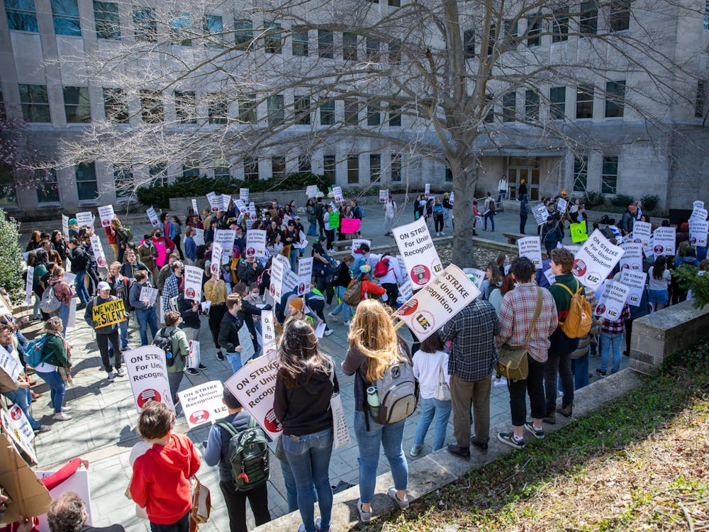 Protestors gather in between Ballantine Hall and the Chemistry Building on April 14, 2022. Undergraduates students held a walkout to show solidarity with the graduate worker strike.