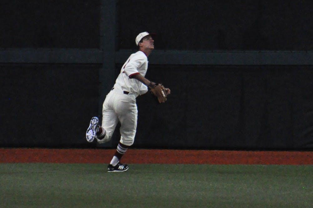 Pitcher Kyle Hart, playing center field late Sunday night, runs towards making the 2nd out of the 9th inning. The Hoosiers overcame a 4 run deficit to beat Purdue 7-6 and sweep the series.