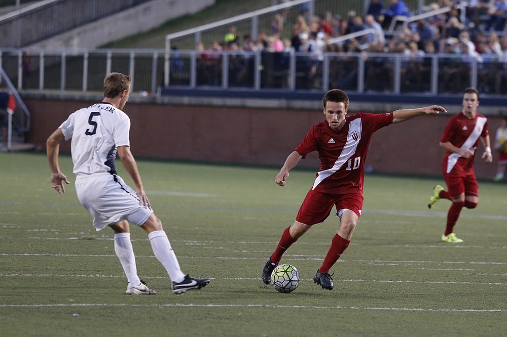 Junior midfielder Tanner Thompson dribbles the ball during IU's game against Bulter on Wednesday at the Butler Bowl. The Hoosiers tied the Bulldogs 2-2.
