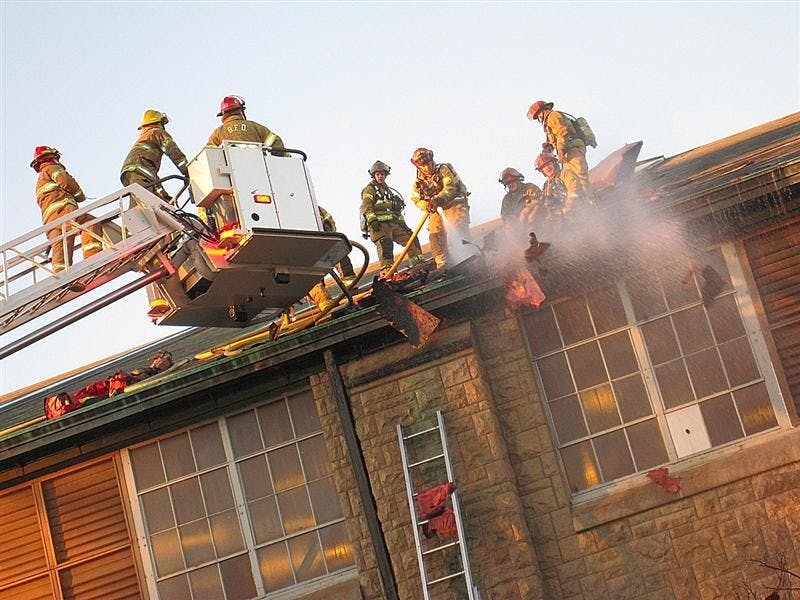 Firefighters battle a blaze atop the Ora L. Wildermuth Intramural Center on Dec. 31 at the School of Health, Physical Education, and Recreation building.