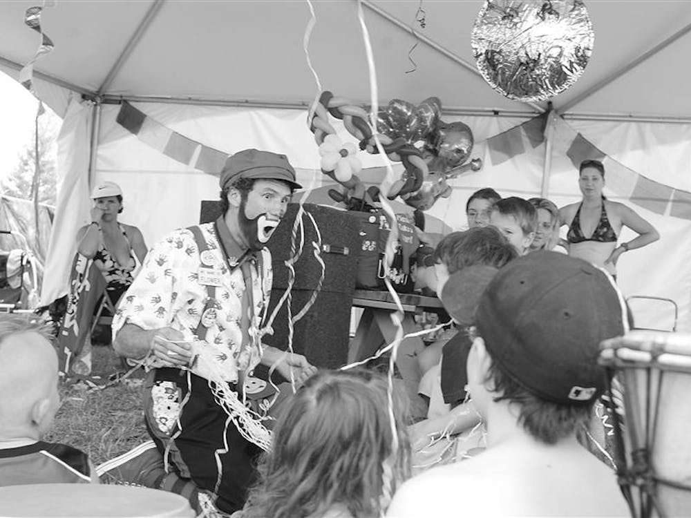 Ron Fowler, also known as Flowers the Clown, performs a magic trick in the Kidz Jam tent. Fowler traveled all the way from Cleveland to entertain kids at Bonnaroo completely free of charge.