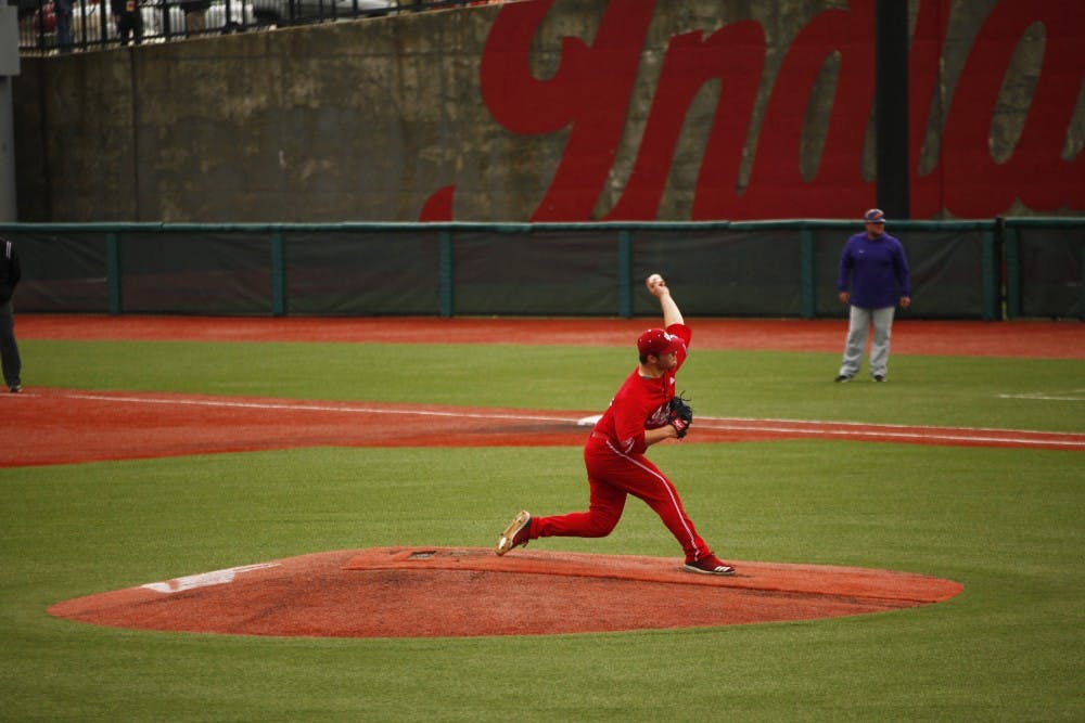 <p>Junior Cam Beauchamp pitches the ball April 14 at Bart Kaufman Field. Beauchamp pitched two strikeouts before being switched with another pitcher. </p>