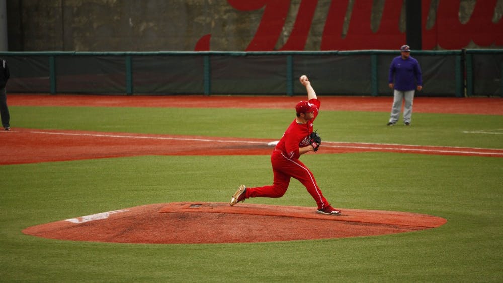 Junior Cam Beauchamp pitches the ball April 14 at Bart Kaufman Field. Beauchamp pitched two strikeouts before being switched with another pitcher. 