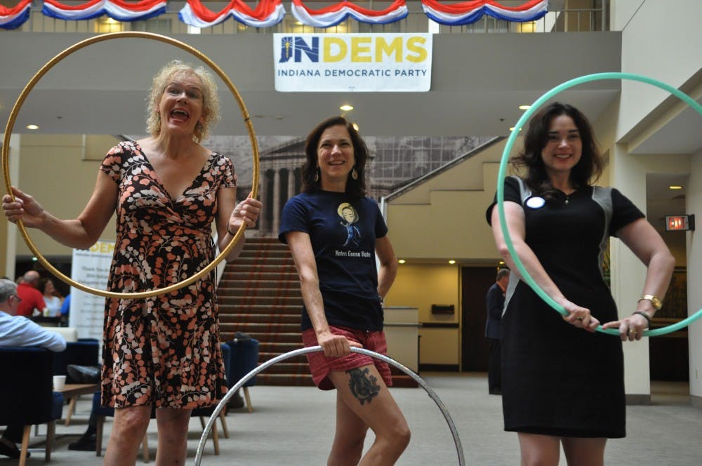 Three Indiana District 9 delegates practice with their hula hoops in the lobby of their hotel the week of the Democratic National Convention.