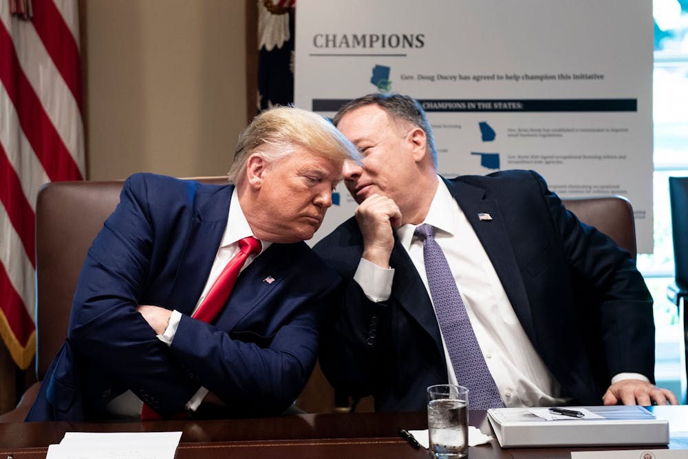 President Donald Trump listens to U.S. Secretary of State Mike Pompeo during a Cabinet Meeting on Oct. 2 in Washington, D.C. 