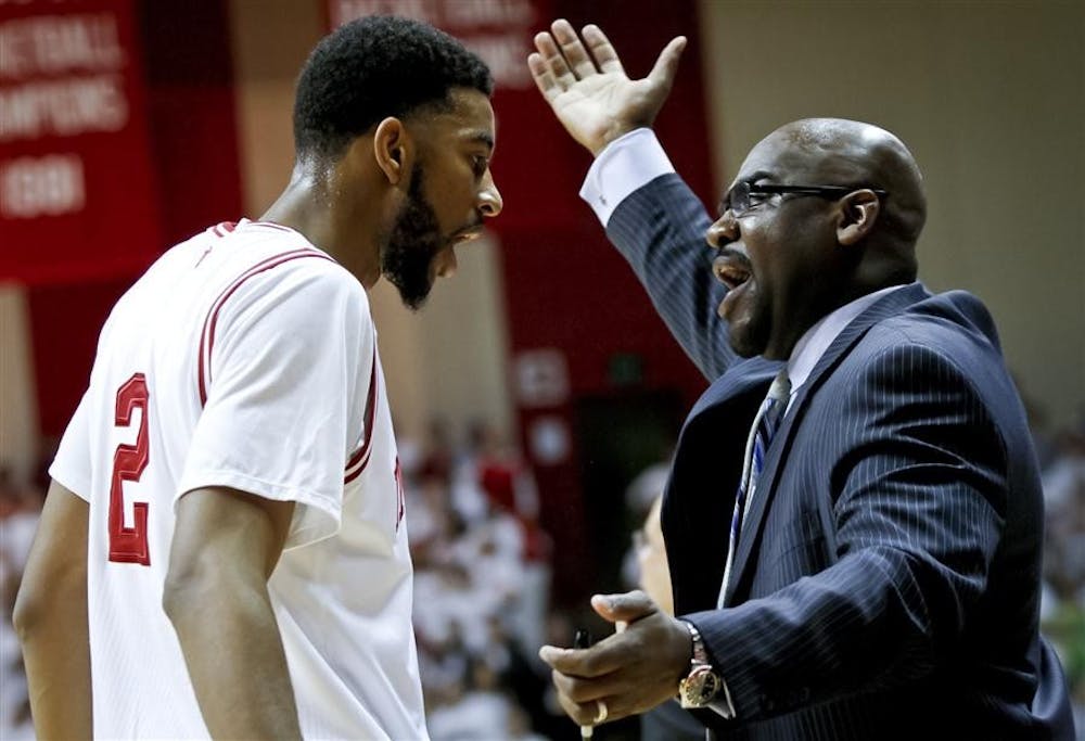 Junior forward Christian Watford talks with assistant coach Bennie Seltzer during IU's 84-71 win against Illinois on Thursday at Assembly Hall.