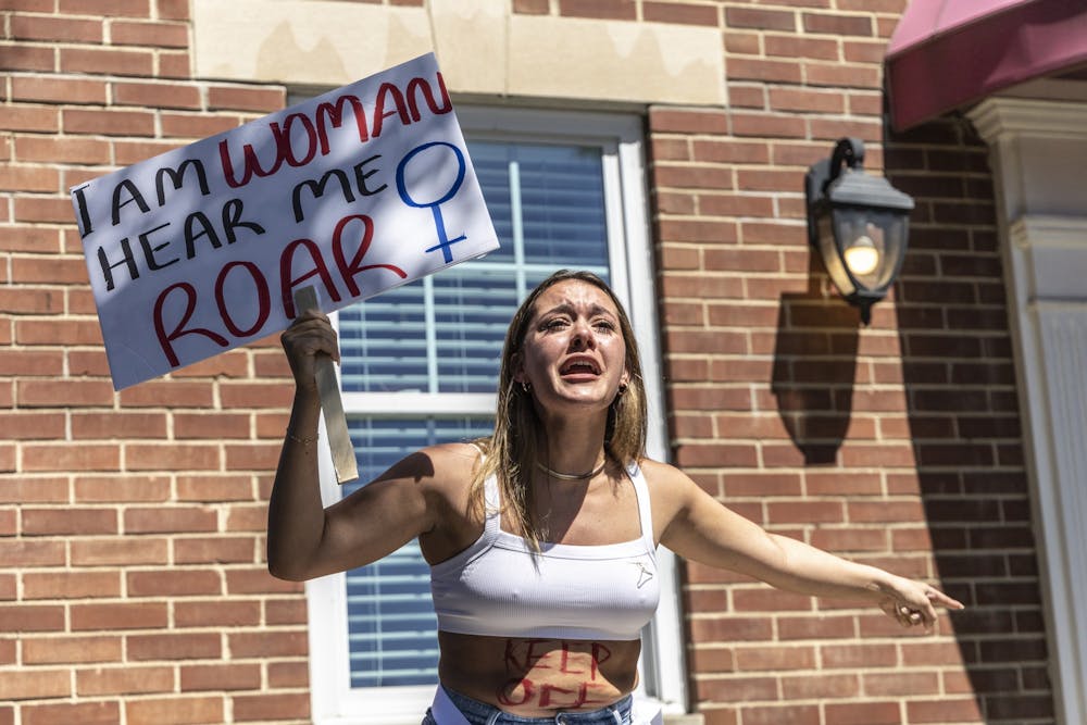 <p>A protestor shares her reasons for supporting access to abortion in front of Women’s Care Center on June 27, 2022, on College Avenue. Throughout March, IU Bloomington will host several events to celebrate Women’s History Month.<br/><br/></p>