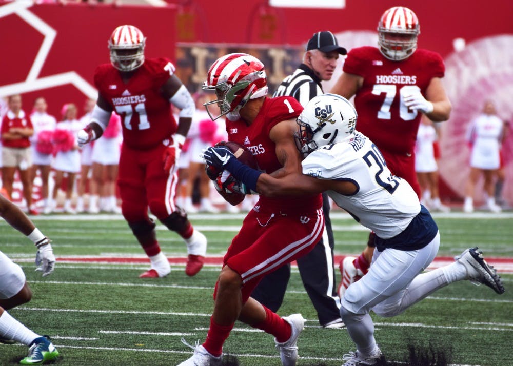 Junior wide receiver Simmie Cobbs Jr. attempts to run the ball before being tackled by Charleston Southern during the Oct. 7 game at Memorial Stadium. Cobbs was one of 11 Hoosiers that have agreed to an NFL deal this offseason.