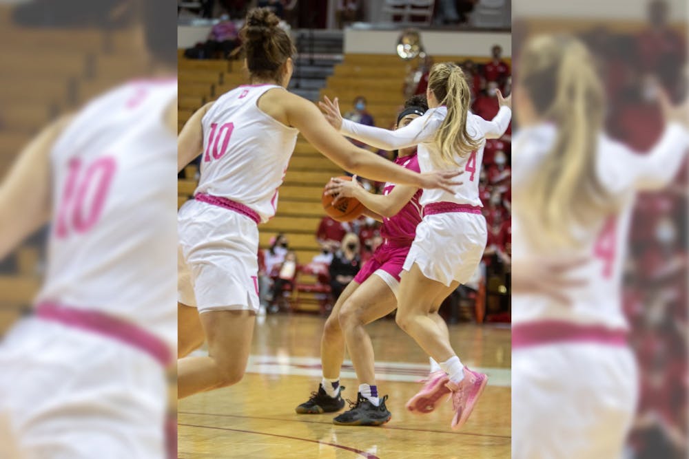 <p>Senior forward Aleska Gulbe and grad-student guard Nicole Cardano-Hillary defend against a Northwestern opponent on Feb. 17, 2022, at Simon Skjodt Assembly Hall. Indiana defeated Northwestern 69-58. </p>