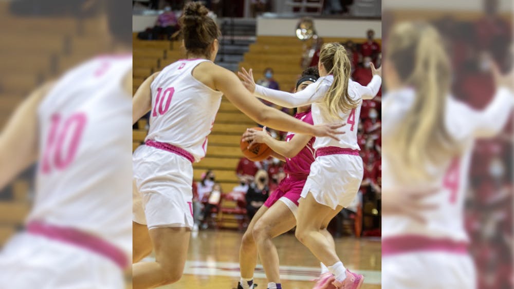 Senior forward Aleska Gulbe and grad-student guard Nicole Cardano-Hillary defend against a Northwestern opponent on Feb. 17, 2022, at Simon Skjodt Assembly Hall. Indiana defeated Northwestern 69-58. 