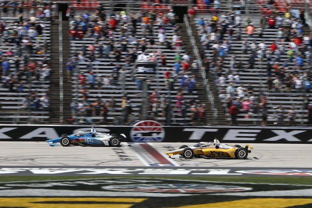 <p>Josef Newgarden beats Team Penske teammate Scott McLaughlin to the finish line on the last lap of the XPEL 375 on March 20, 2022, at the Texas Motor Speedway in Fort Worth, Texas. Newgarden won his second race of the season at the Grand Prix of Long Beach on Sunday.</p>