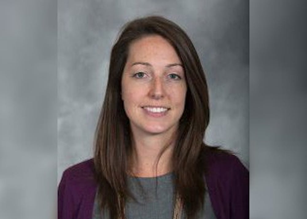 <p>Dr. Caitlin Bernard, an IU Health OB-GYN and assistant professor at the IU School of Medicine, smiles for a portrait. Bernard dropped the lawsuit against Indiana Republican Attorney General Todd Rokita regarding her investigation.</p>