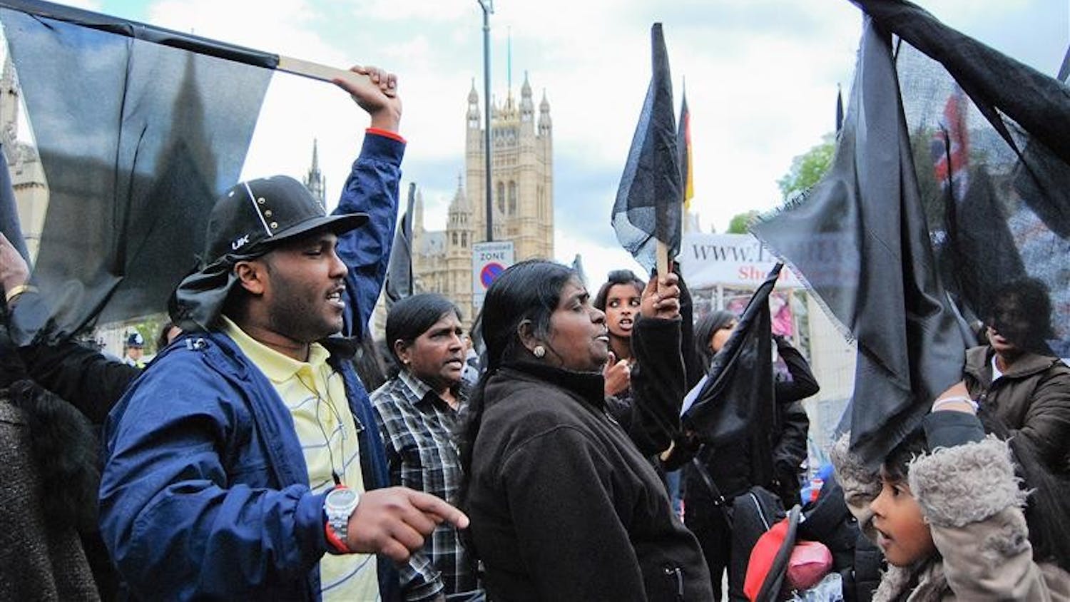 British Tamils gather to support Sri Lanka's Tamil community in Sri Lanka during a vigil Friday afternoon at the Houses of Parliament in London.