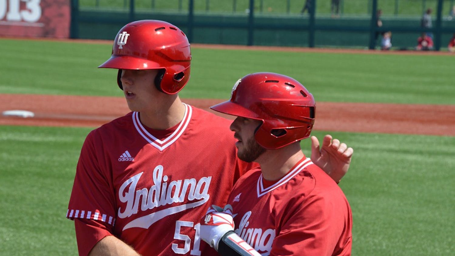 Senior Alex Krupa congratulates junior Logan Sowers on his first double of game three against Nebraska. Sowers hit an RBI double to get IU on the board against Indiana State in the Hoosiers' 2-0 win.