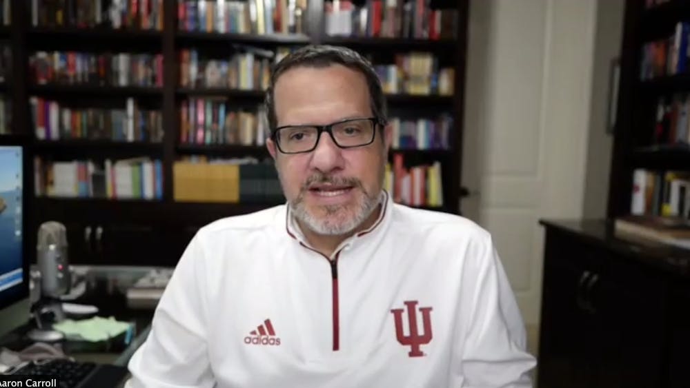 Dr. Aaron Carroll, IU’s director of mitigation testing, speaks Wednesday during an online webinar. Carrol discussed plans for on-departure and on-arrival testing during the webinar. 