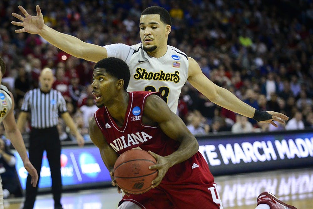 Freshman guard Rob Johnson is guarded by Wichita State's Fred VanVleet during IU's NCAA Tournament game Friday at the CenturyLink Center in Omaha, Neb.