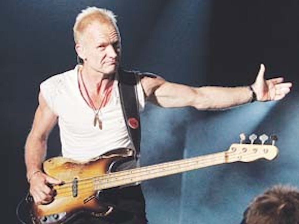 Sting and The Police perform at the Bonnaroo music festival in Manchester, Tenn., Saturday, June 16, 2007.  (AP Photo/Mark Humphrey)