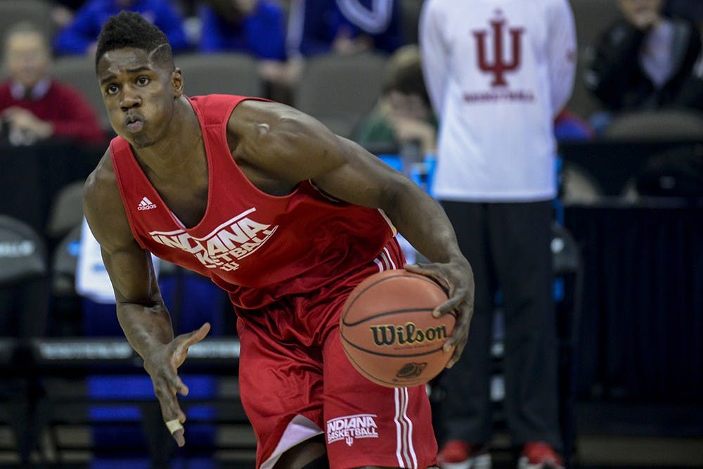 Junior Hanner Mosquera-Perea looks to pass during IU's practice Thursday at CenturyLink Center in Omaha, Neb.