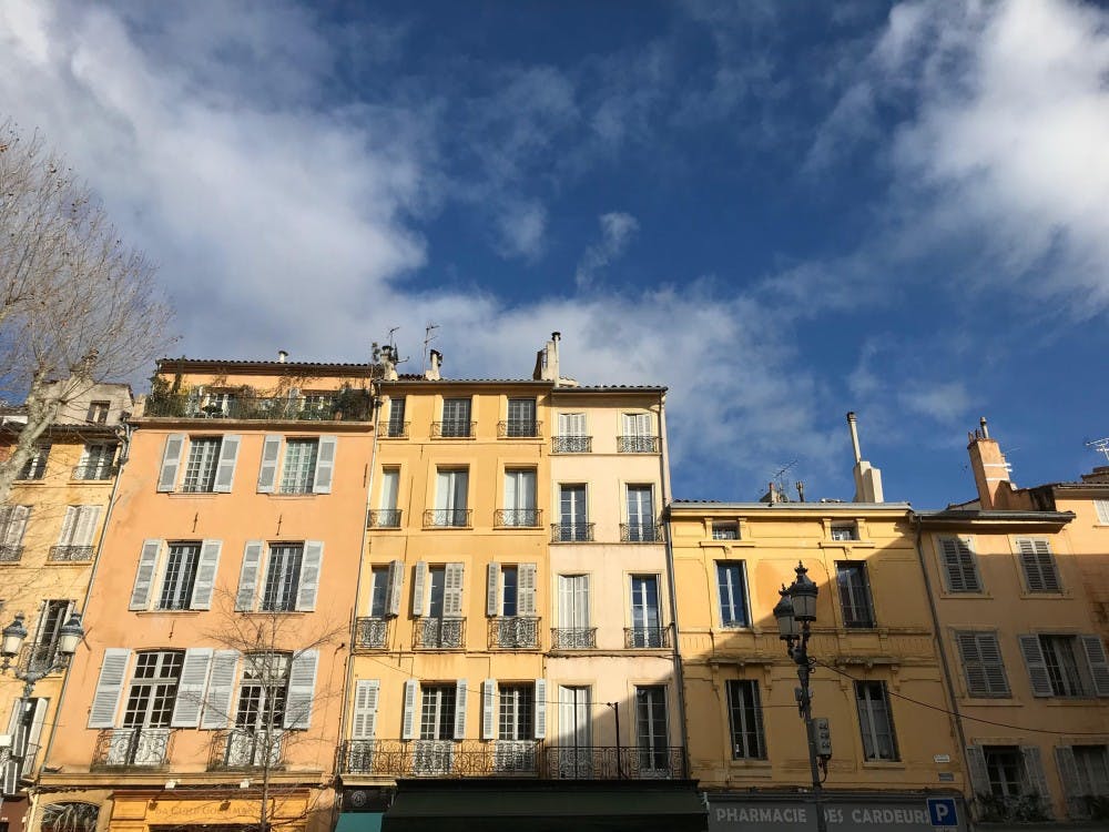 <p>Midafternoon sunlight strikes the building facades in Place de l'Hôtel de Ville, a plaza in Aix-en-Provence, France.</p>