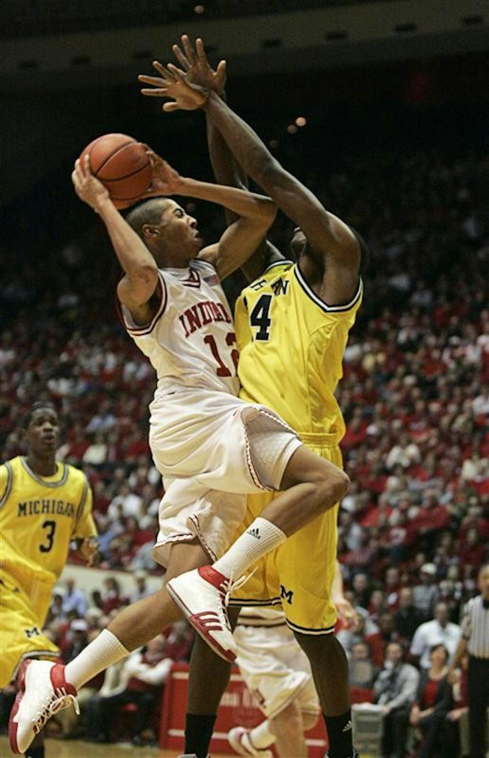 Freshman guard Verdell Jones goes for a baket as Michigan's DeShawn Sims attempts a block Wednesday at Assembly Hall. The Hoosiers face Illinois on the road this Saturday.