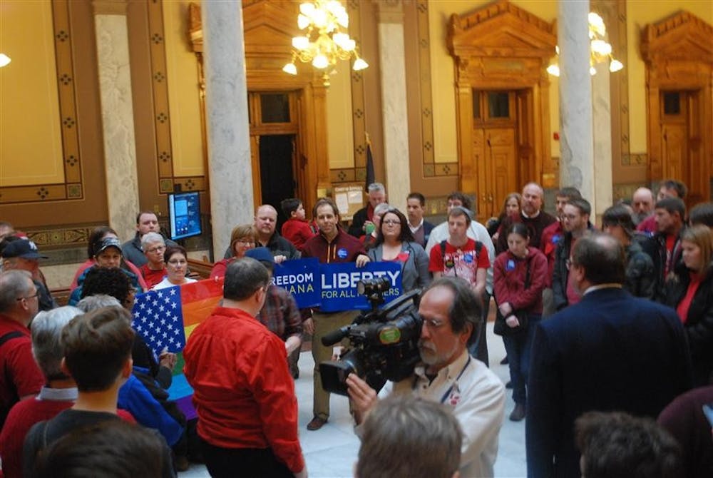 Activists from Freedom Indiana gather on the fourth floor of the Statehouse in Indianapolis after the Senate approved House Joint Resolution 3. The Indiana Senate voted 32-17 in favor of HJR3, a proposed amendment to the Indiana Constitution. 