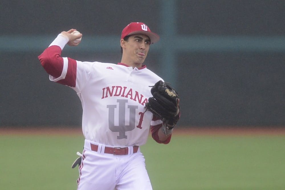 Junior shortstop Nick Ramos throws to first base during IU's home opener against Eastern Michigan on Mar. 10 at Bart Kaufman Field.