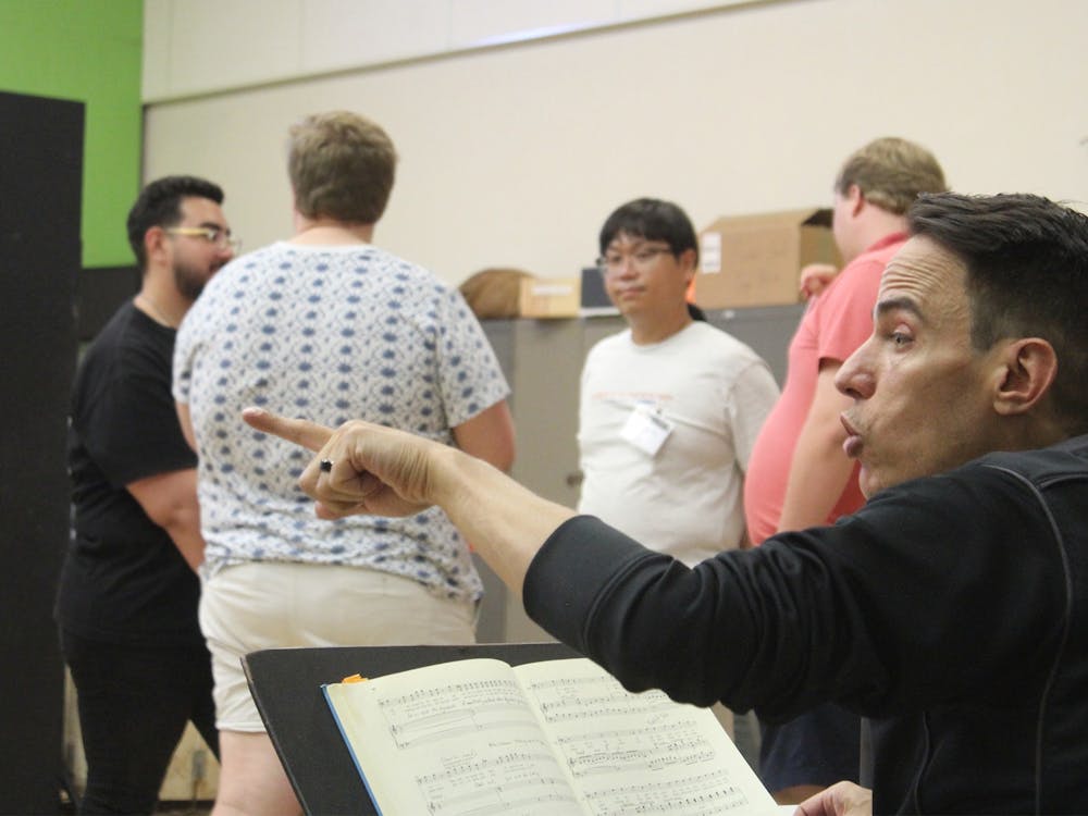 Director Michael Shell gives actors notes during a rehearsal for the Jacobs School of Music Opera and Ballet Theater&#x27;s production of &quot;Don Giovanni.&quot; Performances of the opera will be Sept. 16 to 17 and 23 to 24.