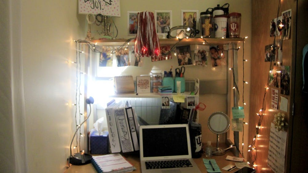 Despite having a small work space, freshman Brooklynn Weisenbach makes the most of it and decorates with photos and Christmas lights. "I only study in my dorm," Weisenbach said. "It's easy for me to differentiate schoolwork and relaxing time even when working in my room."