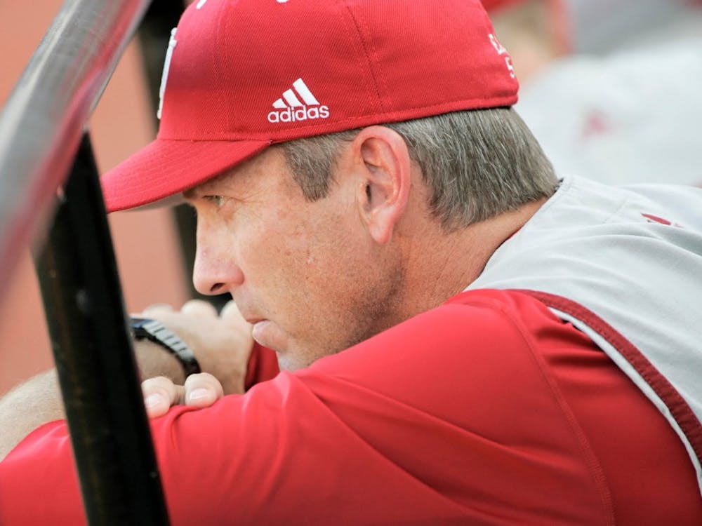 IU head baseball coach Tracy Smith watches the Hoosiers 8-2 loss to Louisville unfold May 29, 2009, at Patterson Stadium. Hoosier pitchers gave up only seven hits but three errors led to four unearned runs for the Cardinals.