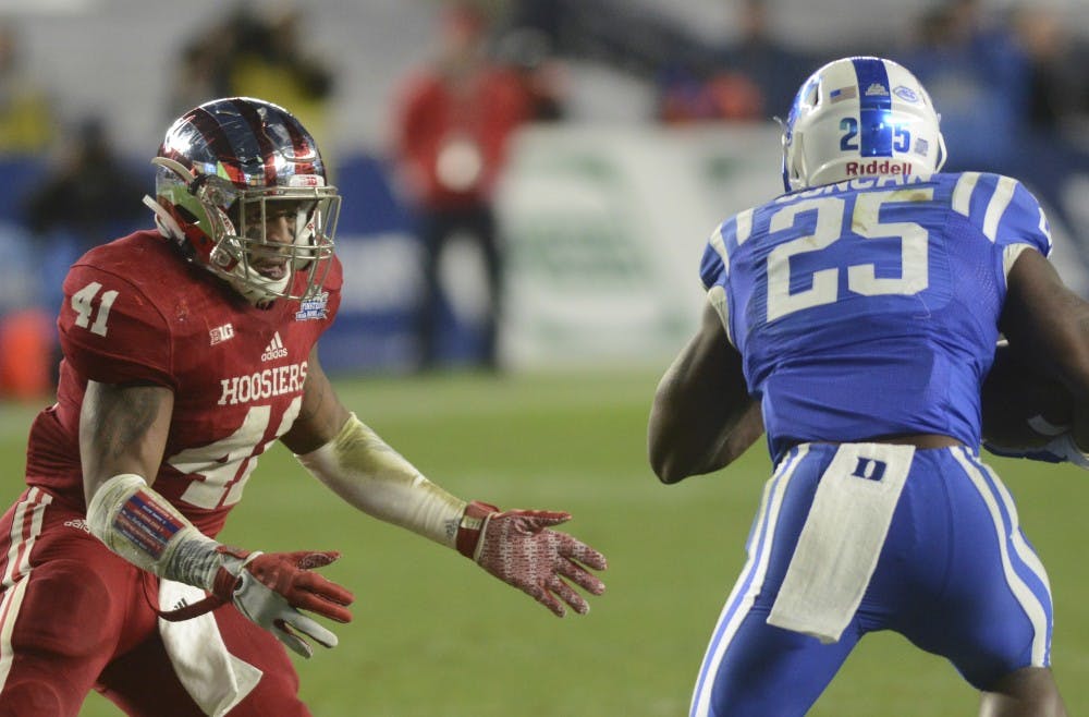 Linebacker Clyde Newton attempts to tackle Duke running back Jela Duncan during the Pinstripe Bowl on Dec. 26 at Yankee Stadium. The Hoosiers lost, 44-41 in overtime.