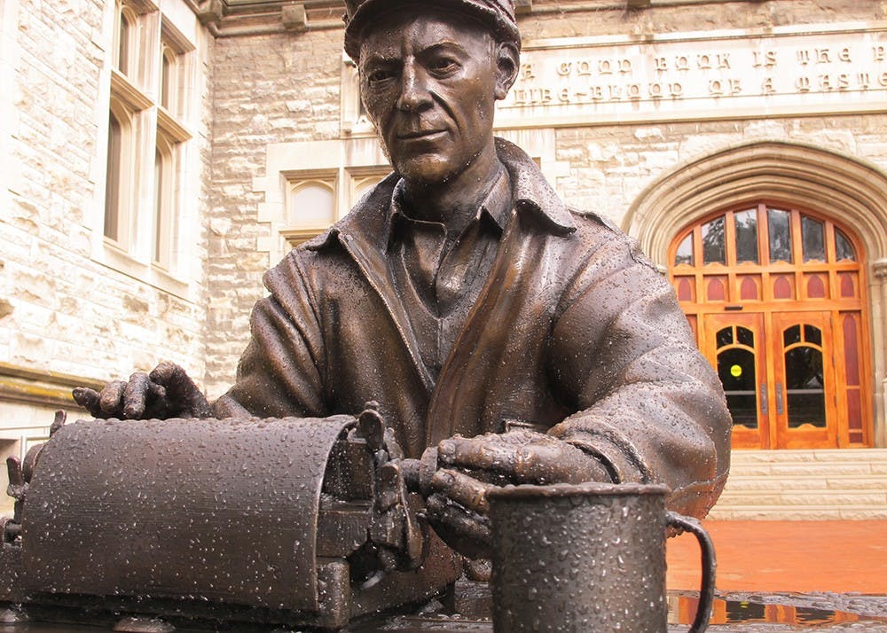 <p>A statue of alumnus and World War II correspondent Ernie Pyle typing on his typewriter sits in front of Franklin Hall. The building houses IU Student Media, including the Indiana Daily Student.&nbsp;</p>